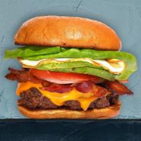 Rise 'N Shine Burger · House-made, half-pound seasoned patty perfectly cooked to medium, topped with bacon, fried e...