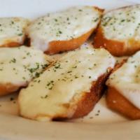 Garlic Bread With Cheese · Fresh Italian bread rubbed generously with butter and fresh garlic, then topped with mozzare...