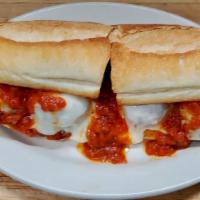 Meatball Parmigiana Hero · Homemade meatballs, served on a hot hero roll with melted mozzarella cheese and tomato sauce.