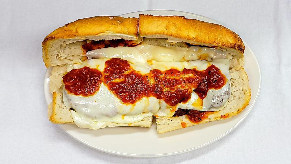 Veal Cutlet Parmigiana Hero · Thin veal cutlets, lightly breaded and fried, served on a hot hero roll with tomato sauce and melted mozzarella.