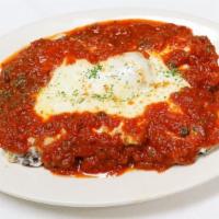Eggplant Parmigiana · Fresh slices of eggplant, lightly breaded and fried, then layered with ricotta cheese, mozza...
