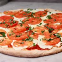 Caprese Pizza · Mozzarella, tomato and basil.