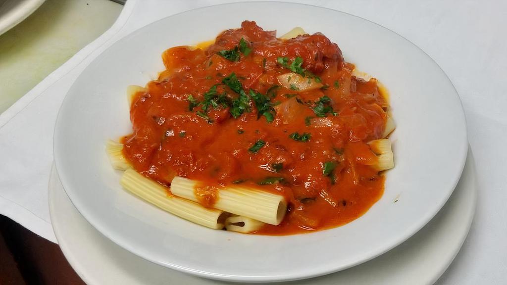 Penne Alla Filetto · Penne or rigatoni pasta served in a sauce made with fresh tomatoes, olive oil, garlic, onions and basil.

pictured: rigatoni