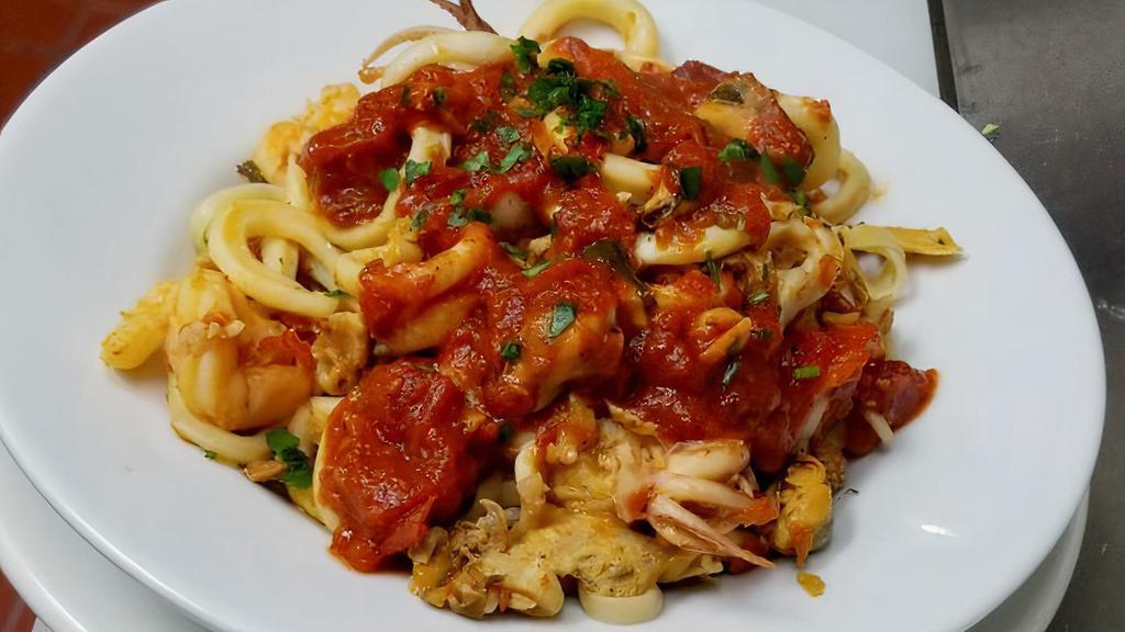 Cappellini Al Mare · Thin cappellini pasta in a homemade marinara sauce with shrimp, calamari, clams and mussels.