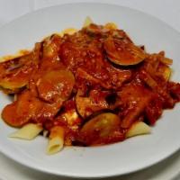 Penne Alla Siciliano · Penne layered with homemade tomato sauce and sauteed eggplant.