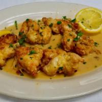 Shrimp Francese · Jumbo shrimp dipped in an egg batter then lightly floured and sauteed in a sauce of white wi...