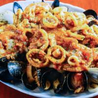 Seafood Combination Plate · Shrimp, mussels, calamari and clams, all sauteed in a marinara sauce ..