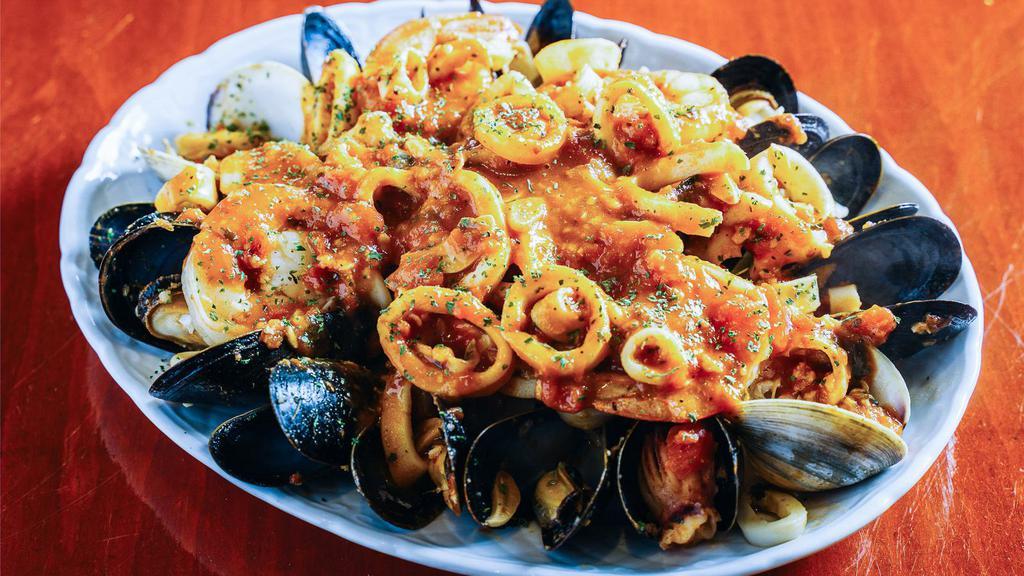 Seafood Combination Plate · Shrimp, mussels, calamari and clams, all sauteed in a marinara sauce ..