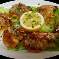 Shrimp Oreganta · Jumbo shrimp stuffed with a mixture of breadcrumbs, olive oil, butter, garlic and oregano. B...