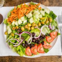 Garden Salad · Fresh crisp romaine topped with tomatoes, cucumbers, carrots, olives, and red onions.