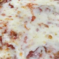 Chicken Parmigiana · Breaded tender chicken cutlets topped with tomato sauce and melted mozzarella served with ch...