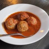 Polpette Di Bue · Wood oven baked beef meat balls, tomato sauce.