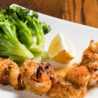 Shrimp Alla Monte · Broiled, seasoned breaded jumbo shrimp served with sautéed broccoli.
