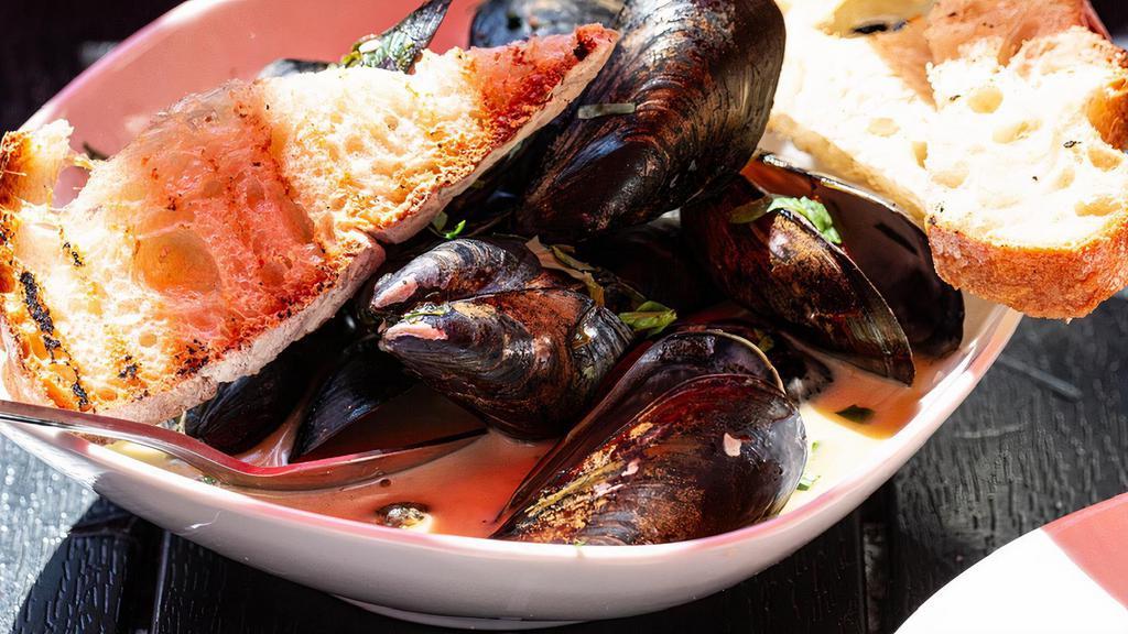 Mussels · P.E.l mussels served with garlic, white wine or a spicy tomato sauce, grilled peasant bread.