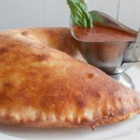 Meatball Calzone · Stuffed pizza pocket, filled with fresh mozzarella and meatballs. Served with a side of warm...