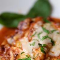 Fuorimano (Manicotti) · Hand rolled pasta sheet, fresh spinach, ricotta, cherry tomato sauce and melted shavings of ...