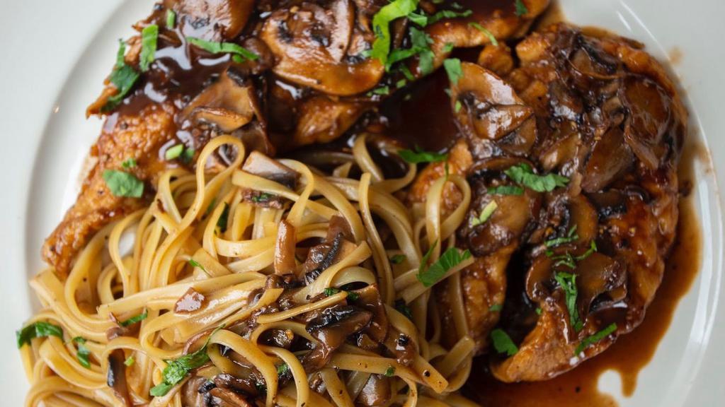 Veal Marsala · Sauteed veal scallopini with a marsala wine and mushroom sauce and served on a bed of linguine.