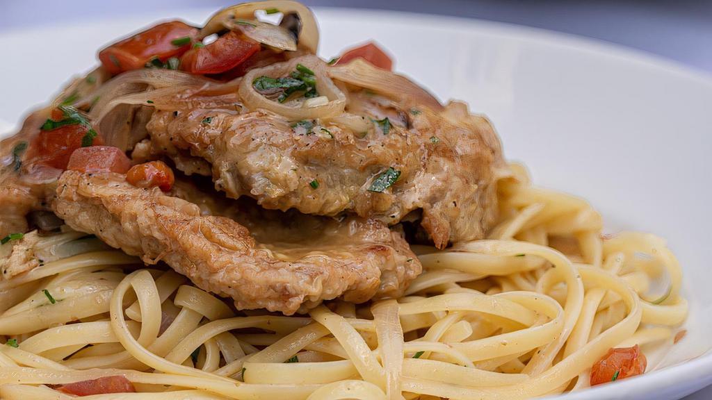 Veal Francese · Lightly egg battered veal scallopini with a lemon, garlic white wine sauce and served on a bed of linguine.