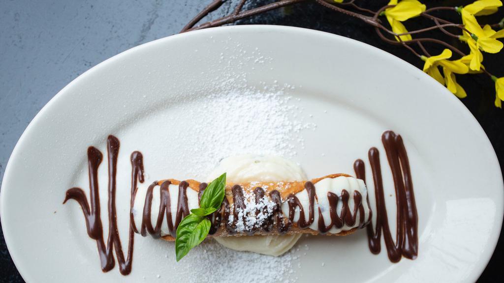 Classic Large Cannoli · Tube-shaped shell of fried dough filled with creamy stuffed ricotta impastata blended with mini chocolate morsels
