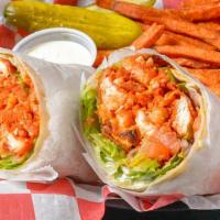 The Cutlass Wrap · Buffalo style chicken tenders , bacon , cheddar cheese, lettuce, tomato, red onions with blu...