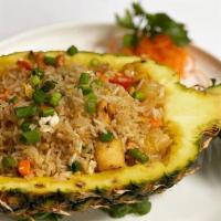Pineapple Fried Rice · Onions, scallions, carrots, green peas, pineapple, eggs and cashews.