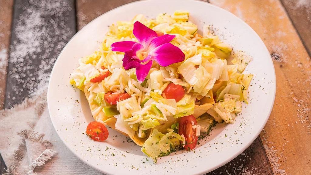 Mojitos Salad · Chopped romaine lettuce, mozzarella cheese, apple, almonds, cucumber, cherry tomatoes and our house dressing served in a crunchy tortilla cup