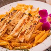 Penne Alla Vodka · Pasta penne made with vodka in creamy  tomatoes sauce, accompanied with toasted garlic bread