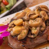 Filet Mignon · Filet mignon rounded with bacon and topped  with mushroom sauce