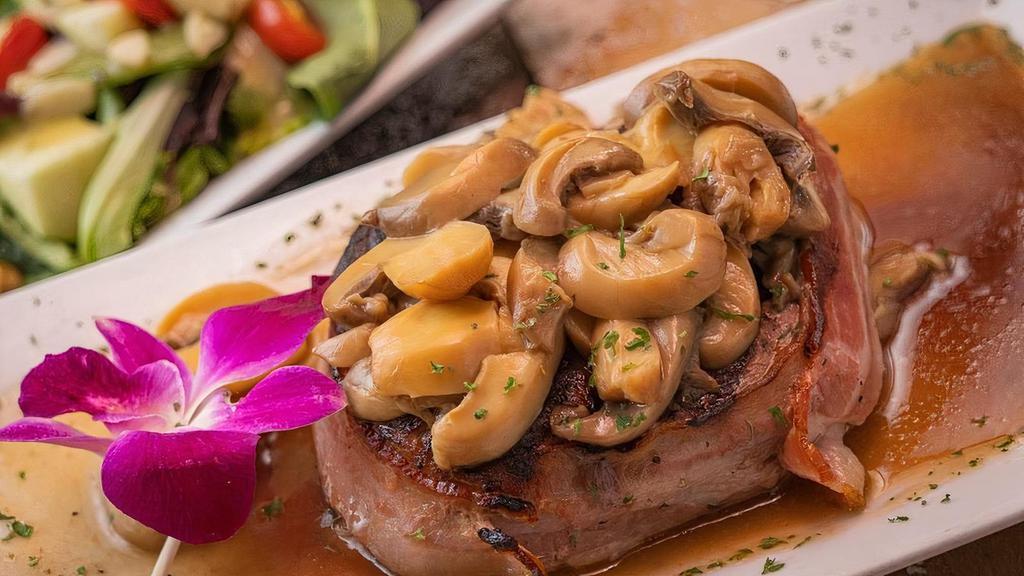 Filet Mignon · Filet mignon rounded with bacon and topped  with mushroom sauce