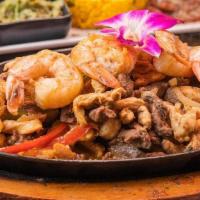 Fajitas Mixtas · Chicken, beef & Shrimp Fajitas mixed in sauteed onions &  peppers, accompanied with yellow r...