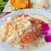 Tesoros Del Mar · Stuffed lobster tail with mixed shrimps, salmon and lobster meat in our special white seafoo...
