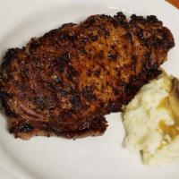 Boneless Rib Eye Steak (12 Oz) · Potato croquete, daily veggies.