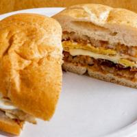 Bacon Egg & Cheese · Bacon, egg, and cheese on Kaiser.
 Served with home fries or Hash brown patties.