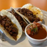 Tacos A La Diabla · Steak, onions and sausage. Served with rice and beans, tomatillo sauce, pico de gallo.