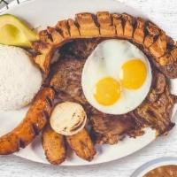 Bandeja Paisa · Typical Colombian dish of steak, pork crackling, chorizo, eggs, rice, and beans.