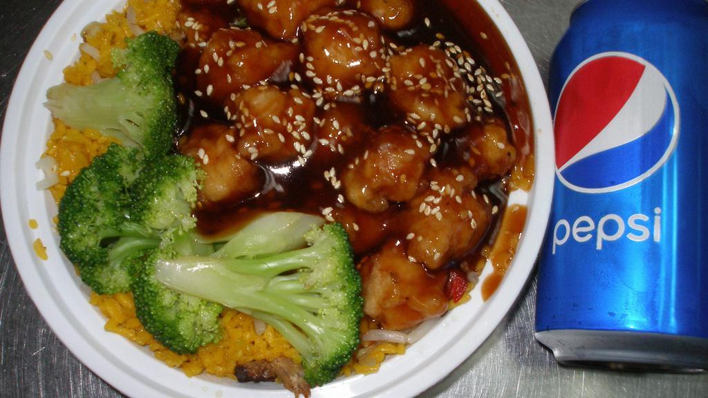 Sesame Chicken · Served with pork fried rice and can soda. made with write mea.