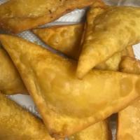 Crab Rangoon (8) · served with sweet sour sauce