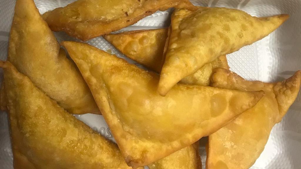 Crab Rangoon (8) · served with sweet sour sauce