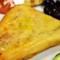Cheese Saganaki · Oven roasted graviera cheese with lemon and olive oil.