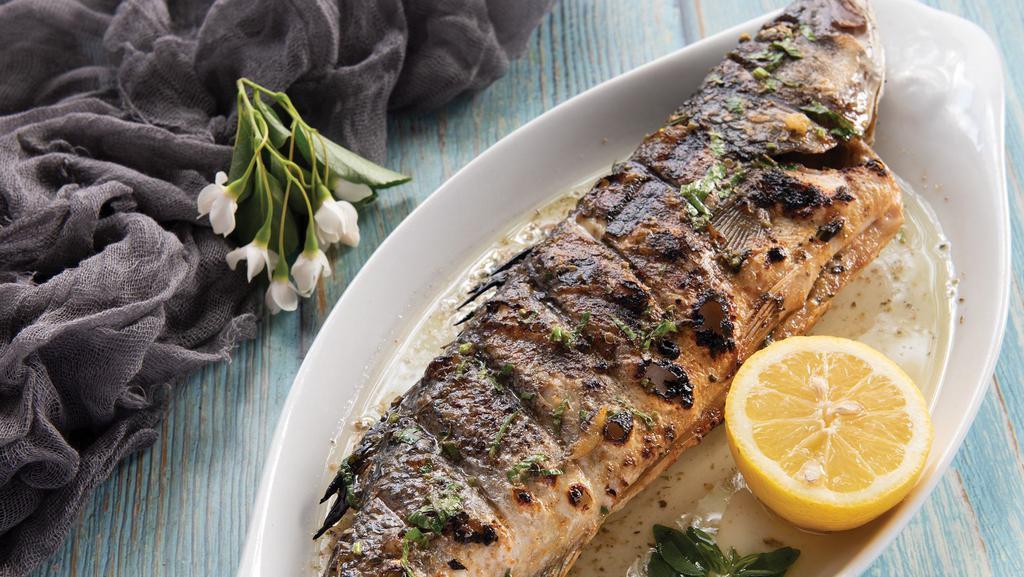 Grilled Bronzini · Whole fish marinated in olive oil and herbs.