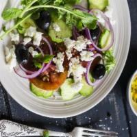 Greek Salad · Romaine, onions, cucumbers, peppers, kalamata olives, greek feta, and red wine herb vinaigre...