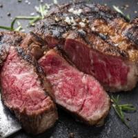 18Oz Grilled New York Strip Steak · Grilled Prime Aged Steak