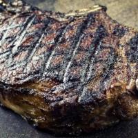 20 Oz Bone In Cowboy Steak · Grilled Prime Aged Steak