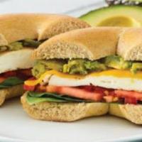 Avocado Egg White · CHOICE OF BAGEL WITH EGG WHITE, AVOCADO, CHEDDAR CHEESE, TOMATO AND SPINACH.