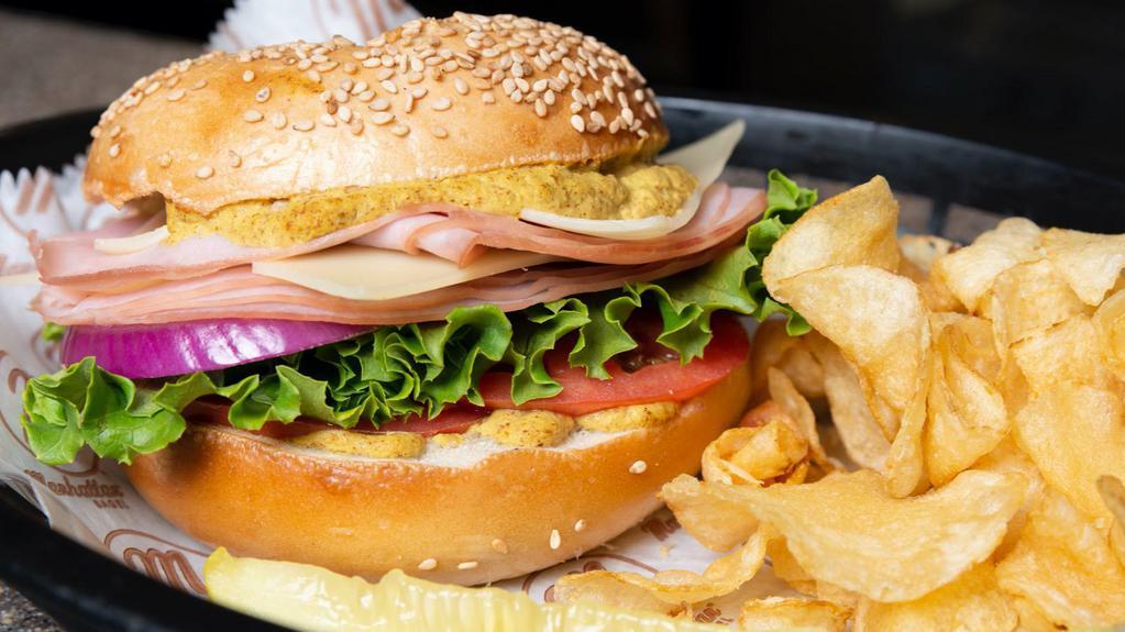 Ham And Swiss · SESAME BAGEL WITH HAM, SWISS, LETTUCE TOMATO AND SPICY MUSTARD WITH CHOICE OF COLESLAW OR MACARONI SALAD