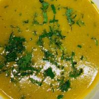 Mulligatawny Soup · Chicken, lentils, coconut, curry leaves.