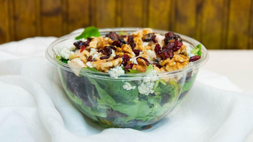 Grilled Chicken Salad · Grilled chicken, crumbled Maytag blue cheese, dried cranberries, toasted walnuts, pure honey and balsamic ginger dressing over mesclun. No substitutions except for greens and dressing.