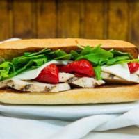Grilled Chicken And Fresh Mozzarella Sandwich · Roasted garlic aioli, roasted red peppers and arugula on a focaccia.