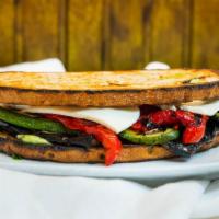 Grilled Vegetables And Fresh Mozzarella Sandwich · Grilled zucchini, eggplant and red peppers, fresh basil, pesto aioli and balsamic vinaigrett...