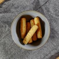 Mozzarella Sticks  · (6) Battered mozzarella fried golden brown and side of tomato sauce.